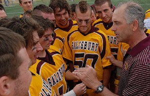 Salisbury University men's lacrosse Head Coach Jim Berkman, right, is shown giving a pep talk to his team. (Photo credit: Salisbury University)