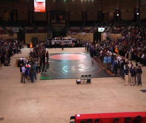 For the State Finals matches in each weight class the arena is broken down to two mats in the center. Here the finalist line up with their parents for announcements and introductions before the finals commence.