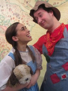 Dorothy (Marissa Barnathan) meets a brainless scarecrow (Eric Dann) along The Yellow Brick Road.