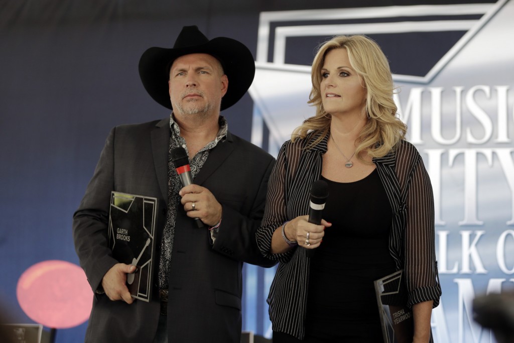 Garth Brooks and Trisha Yearwood speak after receiving stars on the Music City Walk of Fame on Thursday, Sept. 10, 2015, in Nashville, Tenn. (AP Photo/Mark Humphrey)
